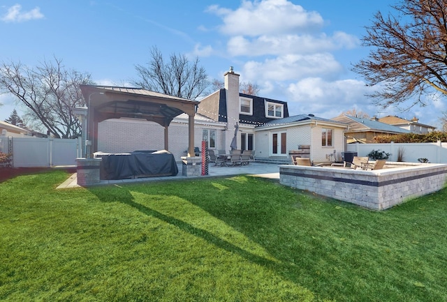 back of house featuring a yard, a gazebo, and a patio area