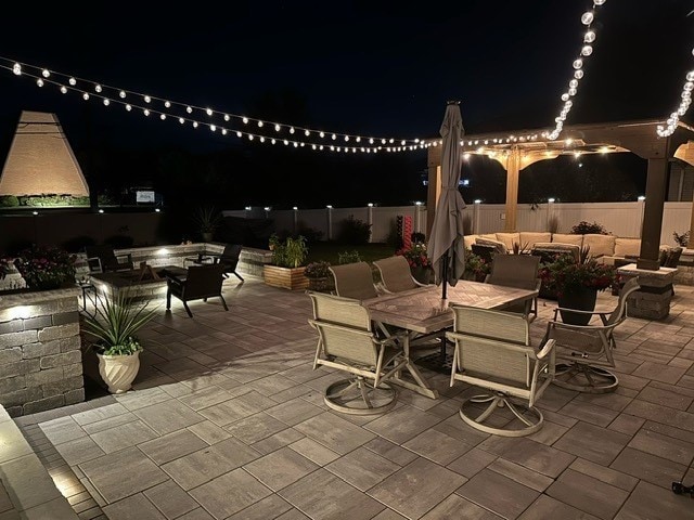 view of patio featuring an outdoor living space with a fire pit