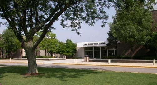 view of property's community featuring a lawn