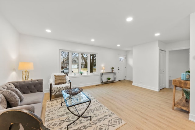 living room with light hardwood / wood-style flooring