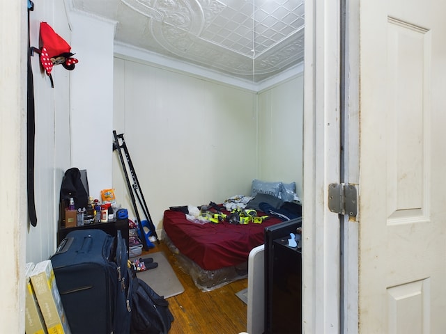 bedroom with hardwood / wood-style floors