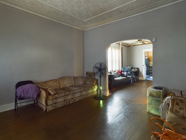 living room with hardwood / wood-style flooring and ceiling fan