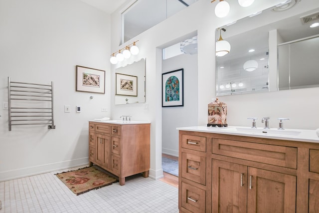 bathroom featuring vanity, radiator heating unit, and walk in shower