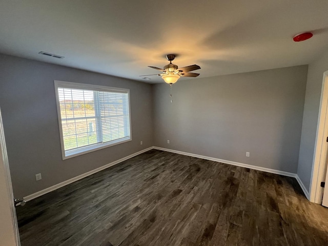 1107 S 2nd St, Oregon, IL 61061 - unfurnished room featuring dark wood-type flooring and ceiling fan