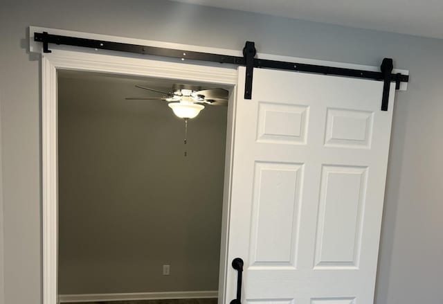 1107 S 2nd St, Oregon, IL 61061 - details featuring a barn door and ceiling fan