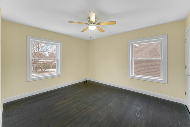 unfurnished room featuring dark hardwood / wood-style floors and ceiling fan