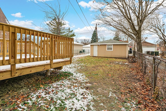 view of yard with an outdoor structure and a deck