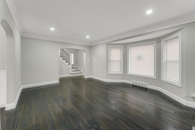 unfurnished room with ornamental molding and dark hardwood / wood-style floors