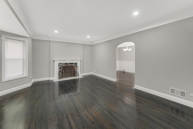 unfurnished living room with ornamental molding, dark hardwood / wood-style floors, and a high end fireplace