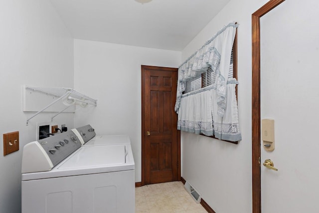 laundry area featuring washing machine and dryer