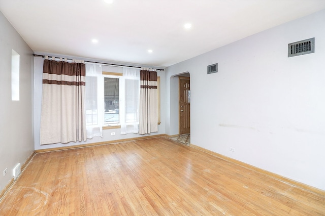 spare room with light hardwood / wood-style flooring