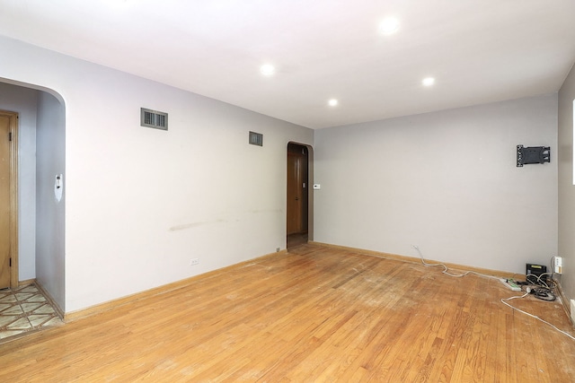 spare room with light hardwood / wood-style floors