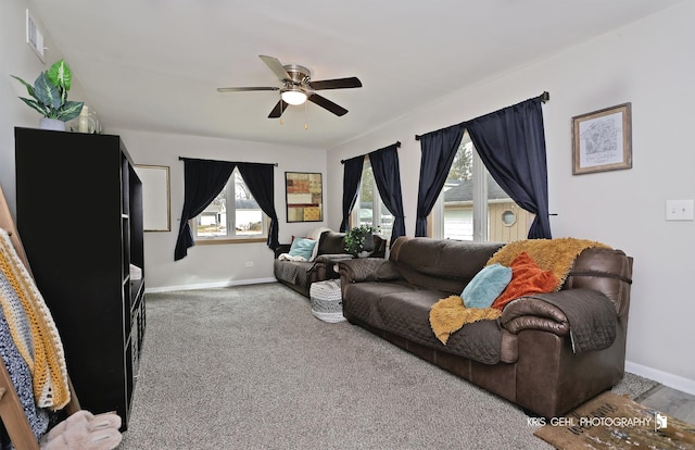 carpeted living room featuring ceiling fan