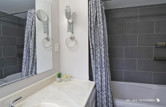 bathroom featuring vanity and shower / bath combo