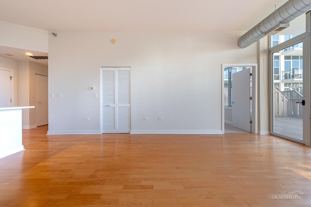 spare room with light hardwood / wood-style flooring