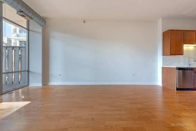 interior space with sink and light hardwood / wood-style flooring