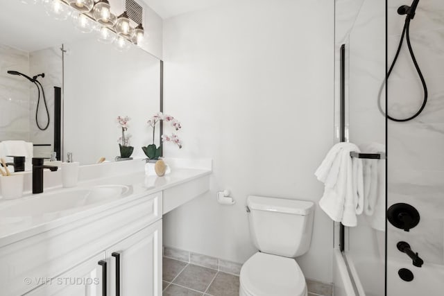 full bathroom featuring tile patterned flooring, vanity, bath / shower combo with glass door, and toilet