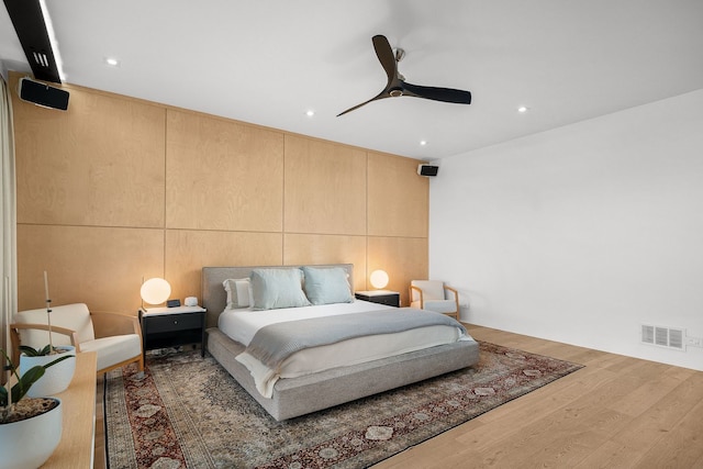 bedroom with hardwood / wood-style flooring and ceiling fan