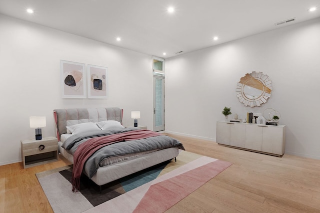 bedroom with light hardwood / wood-style floors