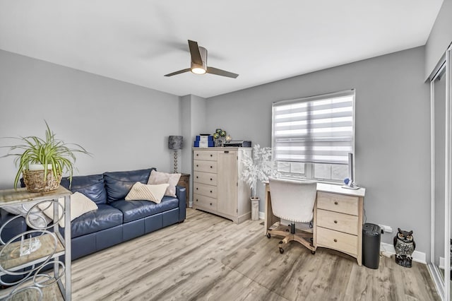 office area featuring light hardwood / wood-style flooring and ceiling fan