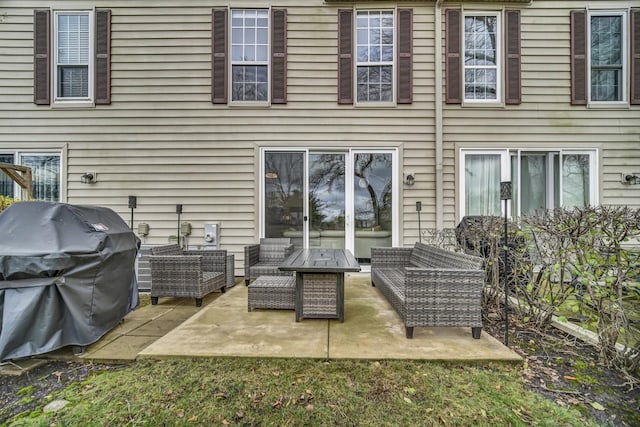 rear view of property with an outdoor hangout area and a patio area