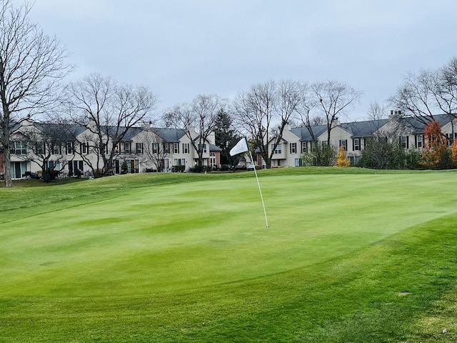 view of property's community featuring a lawn