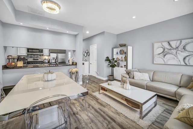 living room with light hardwood / wood-style floors