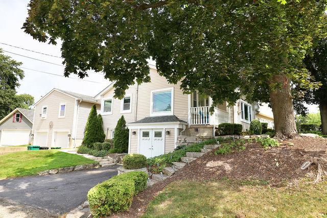 view of front of home with a garage and a front yard