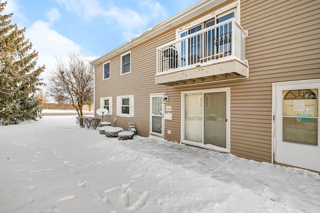 view of snow covered house