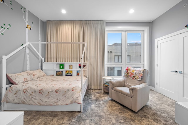 bedroom featuring dark colored carpet