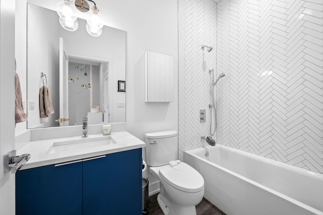 full bathroom featuring vanity, toilet, and tiled shower / bath combo