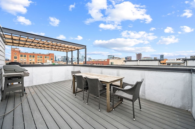 wooden terrace featuring a grill