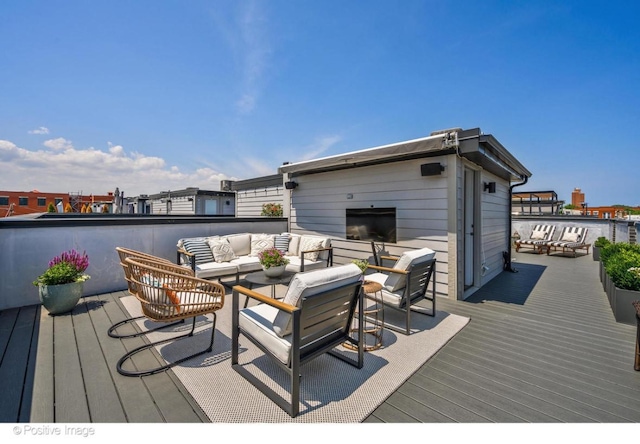 wooden deck with an outdoor living space