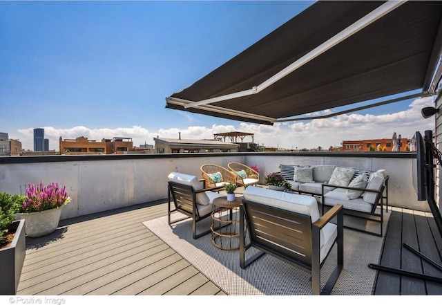 wooden terrace featuring an outdoor living space