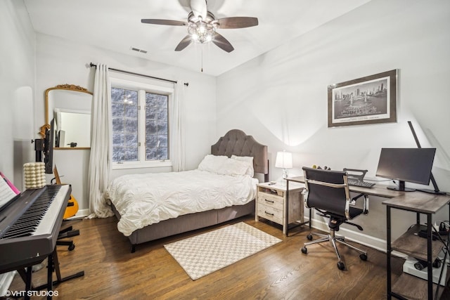 bedroom featuring dark hardwood / wood-style floors and ceiling fan