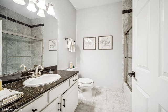 full bathroom featuring vanity, enclosed tub / shower combo, toilet, and an inviting chandelier