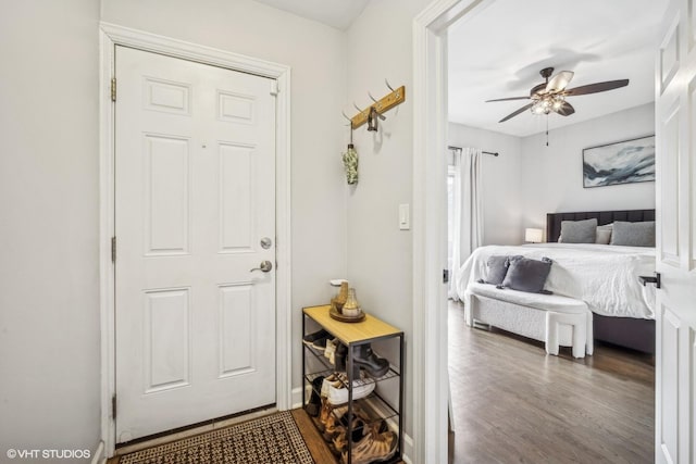 bedroom with ceiling fan and wood-type flooring