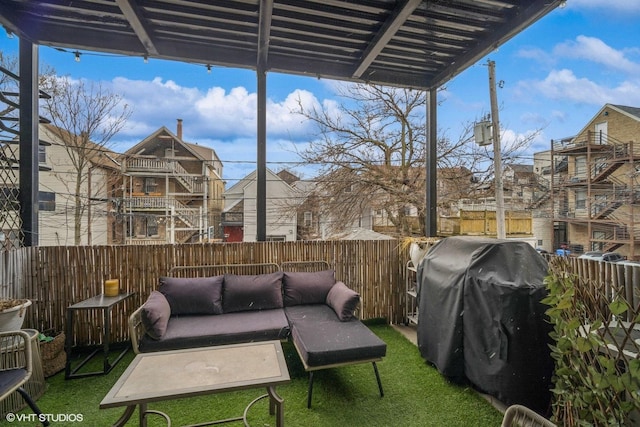 view of patio with grilling area and an outdoor hangout area