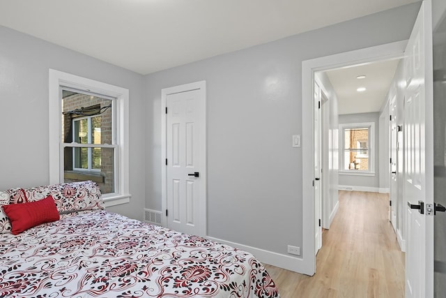 bedroom with light hardwood / wood-style floors