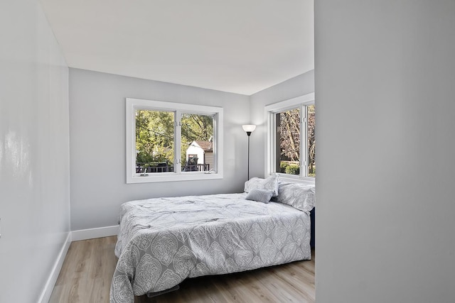 bedroom with light wood-type flooring