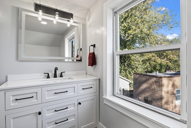 bathroom featuring vanity and a wealth of natural light