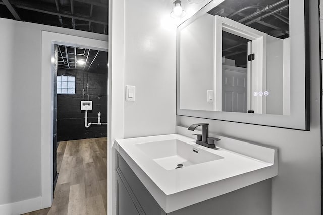 bathroom featuring vanity and wood-type flooring