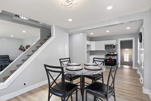 dining area with light hardwood / wood-style floors