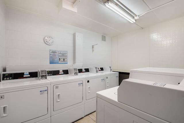 washroom featuring washing machine and dryer