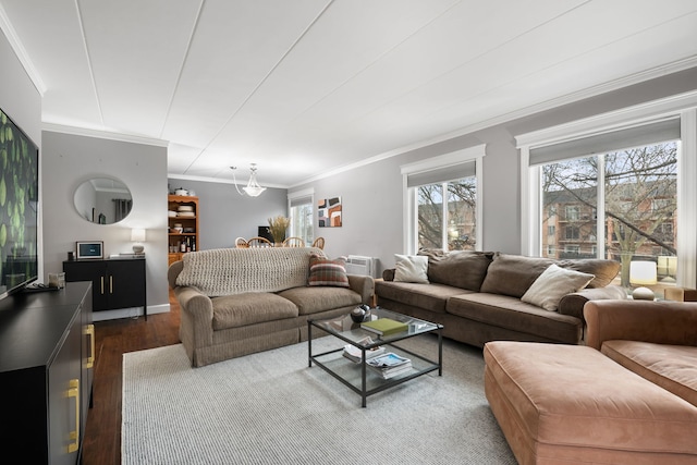 living room with hardwood / wood-style floors and crown molding