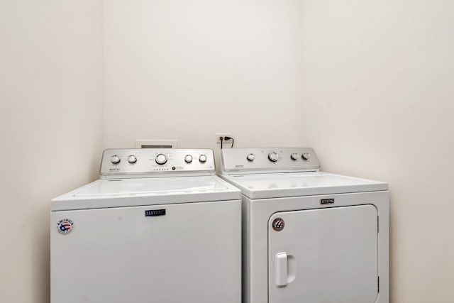 laundry room featuring separate washer and dryer