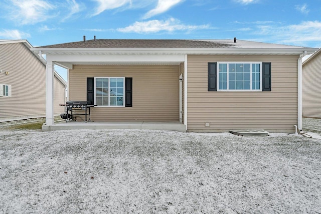 back of property featuring a patio