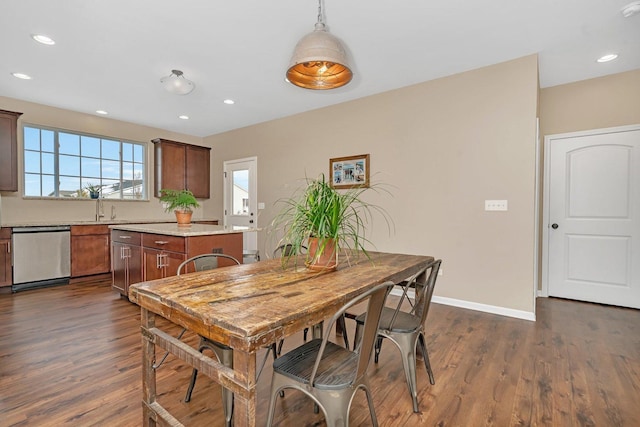 dining room with dark wood-type flooring and sink