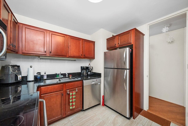 kitchen featuring stainless steel appliances and sink