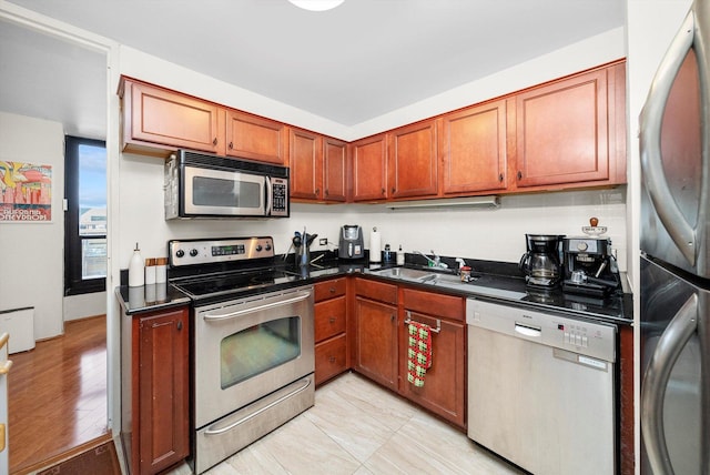 kitchen with appliances with stainless steel finishes and sink